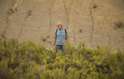 Adult man between grass on tabernas desert in almeria, spain