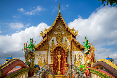 Low angle view of temple against building