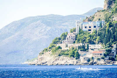 View of buildings by sea