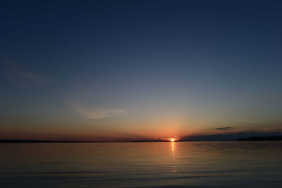 Scenic view of sea against romantic sky at sunset