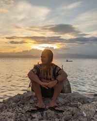 A young admiring the sunset in moalboal, cebu. 