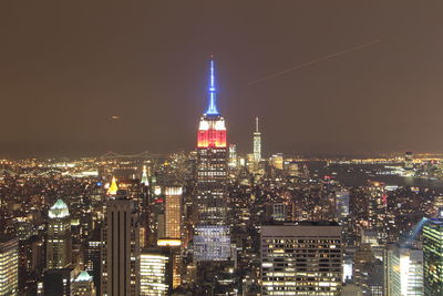 Illuminated buildings in city at night