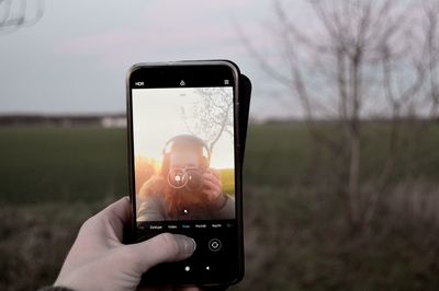 Hand holding mobile phone