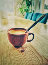 Close-up of coffee cup on table