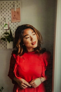 Girl looking away while standing at home