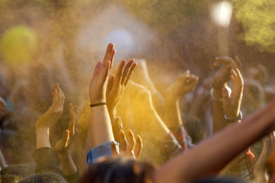 Cropped hand during holi