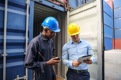 Engineers working by cargo container