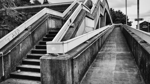 Empty footbridge by steps