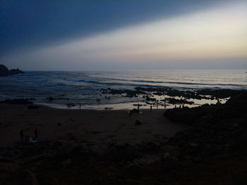 Scenic view of beach against sky during sunset