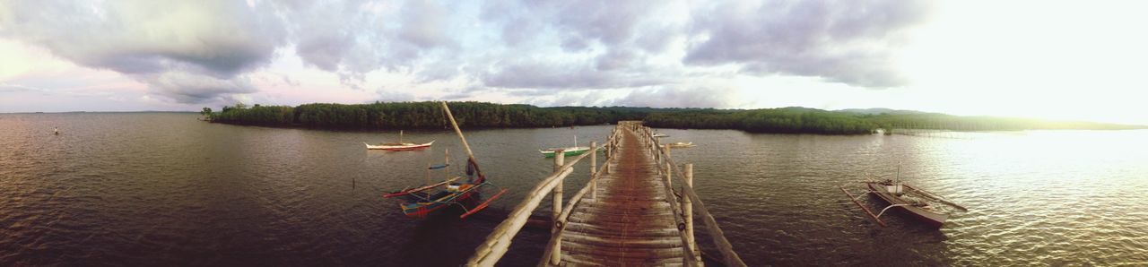 water, transportation, nautical vessel, sky, mode of transport, boat, cloud - sky, sea, tranquility, tranquil scene, scenics, beauty in nature, nature, moored, cloudy, cloud, waterfront, travel, rippled, idyllic