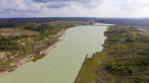 High angle view of river amidst landscape against sky