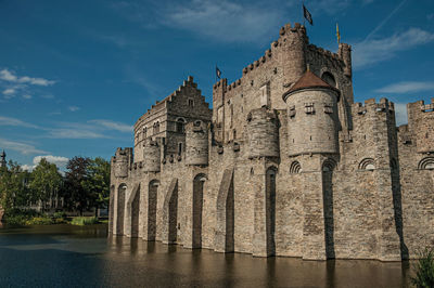 Stone wall and tower at the gravensteen castle in ghent. a city with gothic buildings in belgium.