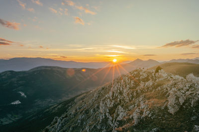 Scenic view of mountains against sky during sunset