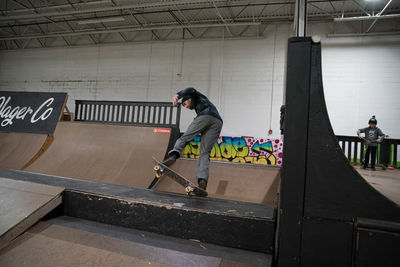 Full length of man skateboarding on skateboard