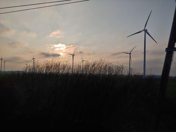 Scenic view of field against sky during sunset