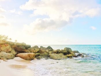Scenic view of sea against cloudy sky