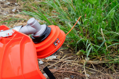 Close-up of red tire on field