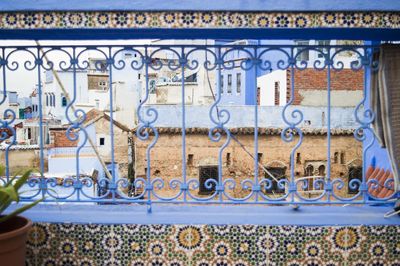 Close-up of padlocks hanging on wall of building