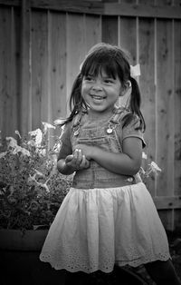 Black and white portrait of cute girl smiling