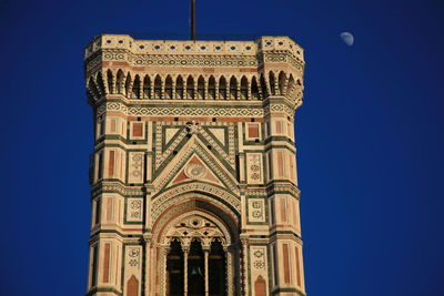 Low angle view of a building against blue sky