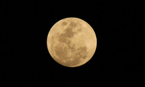 Low angle view of moon against sky at night