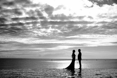 Scenic view of sea against cloudy sky