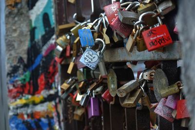 Padlocks hanging on railing