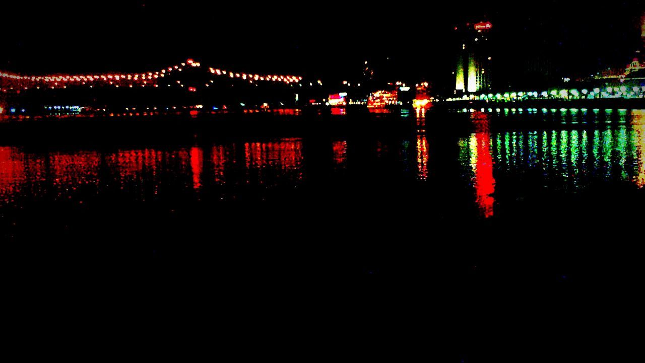 night, illuminated, water, river, built structure, architecture, reflection, connection, bridge - man made structure, red, dark, lighting equipment, waterfront, light, glowing, outdoors, bridge, light - natural phenomenon, building exterior, city