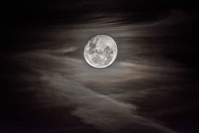 Low angle view of moon against sky at night