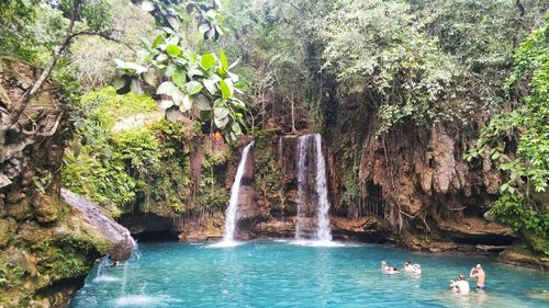 Scenic view of waterfall in sea