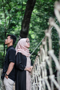 Young couple standing in a forest