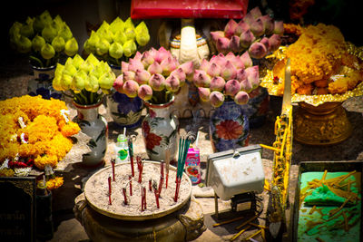 Various flowers for sale at market stall