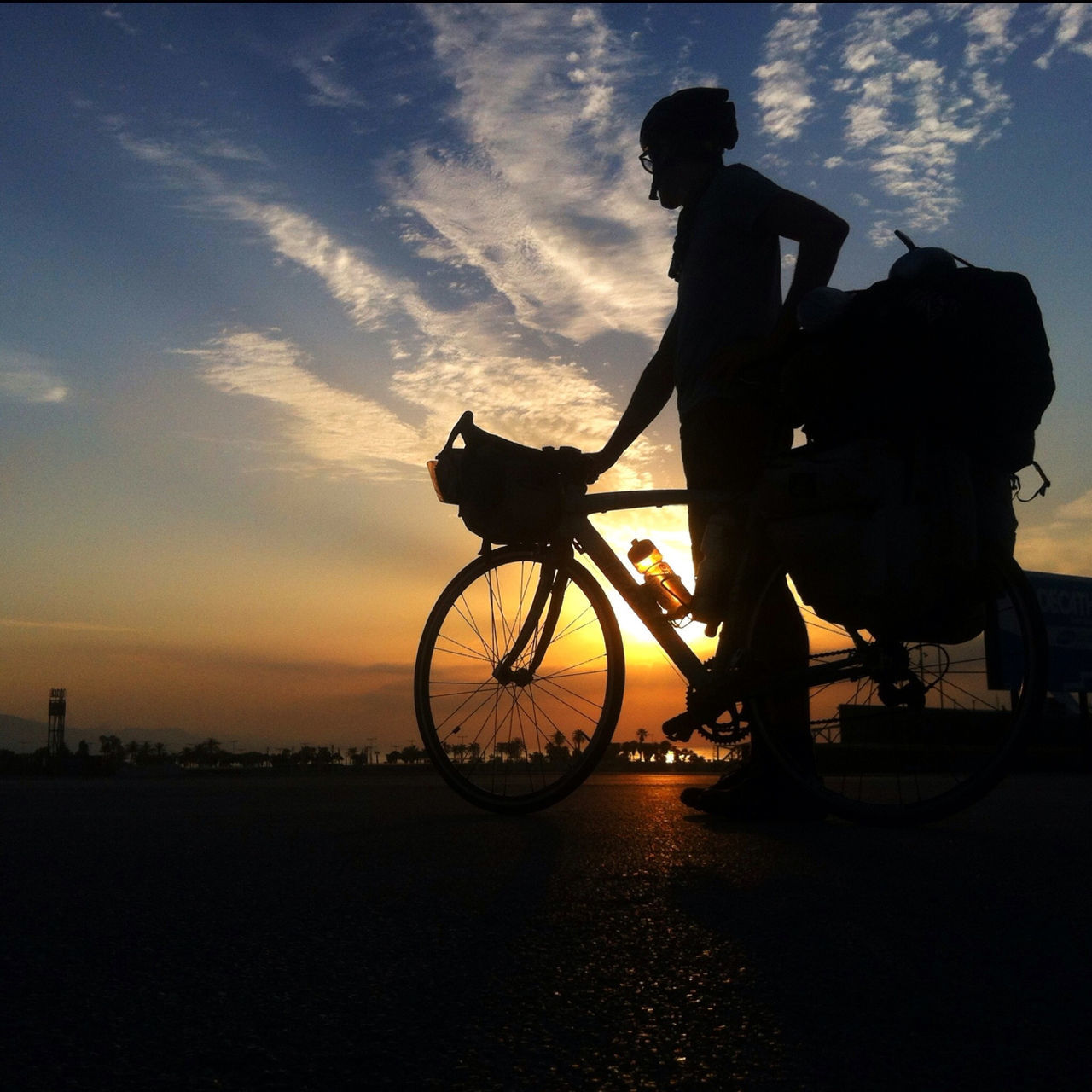 bicycle, transportation, mode of transport, land vehicle, riding, men, cycling, silhouette, sky, leisure activity, lifestyles, full length, stationary, motorcycle, side view, sunset, on the move, travel