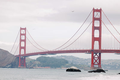 Famous golden gate bridge on cloudy day, view from the baker beach
