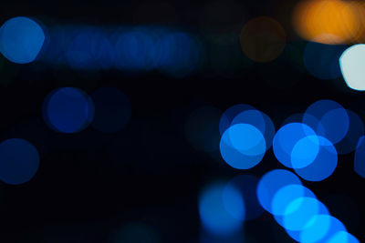 Defocused image of illuminated lights at night