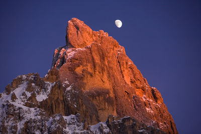 Low angle view of rock formation against sky