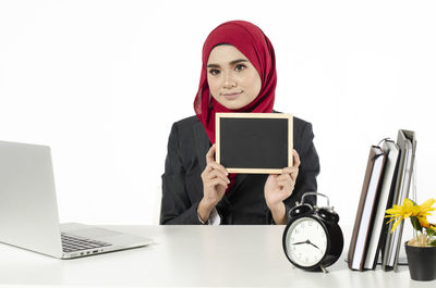 Portrait of young woman using smart phone