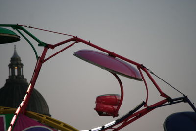 Low angle view of ferris wheel against sky