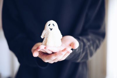 Midsection of woman holding stuffed toy