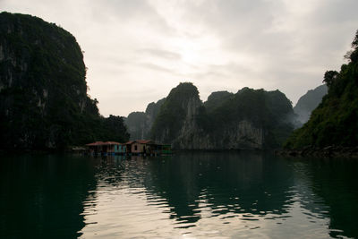 Scenic view of lake and mountains against sky