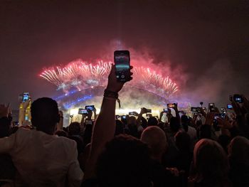 People enjoying music concert at night