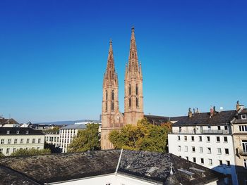 View of temple building against clear blue sky