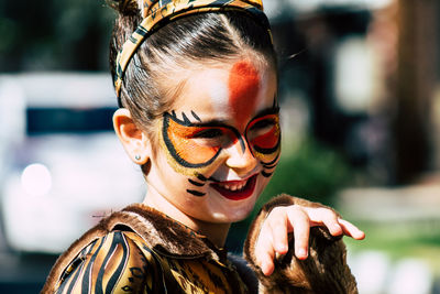 Close-up portrait of smiling young woman