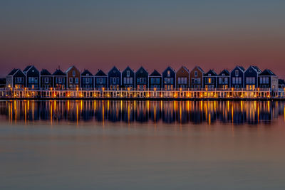 Rainbow wooden houses at sunset in houten, a little suburb of utrecht in south holland