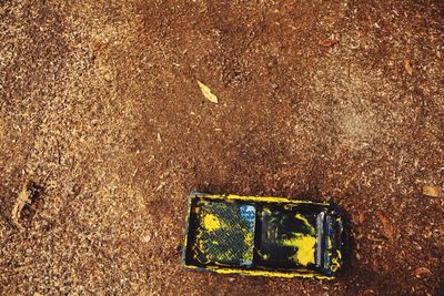 High angle view of old toy car on field