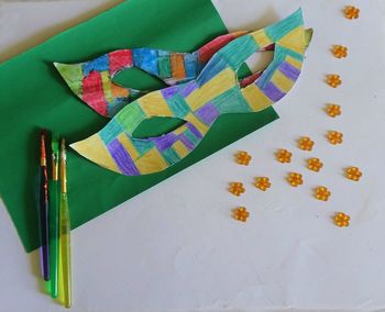 High angle view of multi colored paper on table