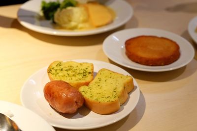 Close-up of food served in plates on table