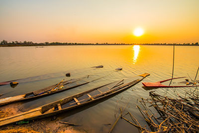 Scenic view of lake against sky during sunset