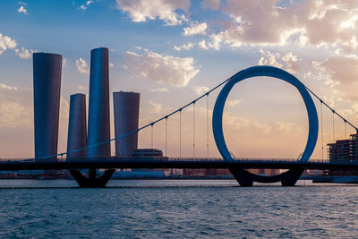 Plaza tower lusail with arch bridge sunset time