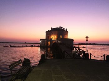 Scenic view of sea against orange sky